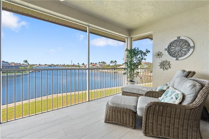 Sunroom / solarium with a water view