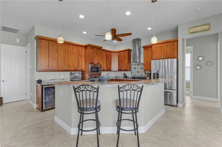 Kitchen with snack bar and Cherry Cabinets.