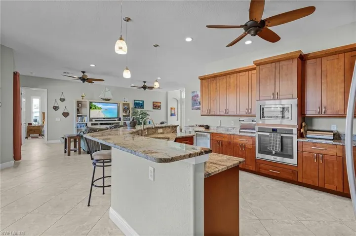 Large kitchen.  Wall oven, microwave, and under counter refrigerator.