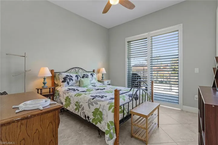 Guest bedroom #1 with sliders to pool.
