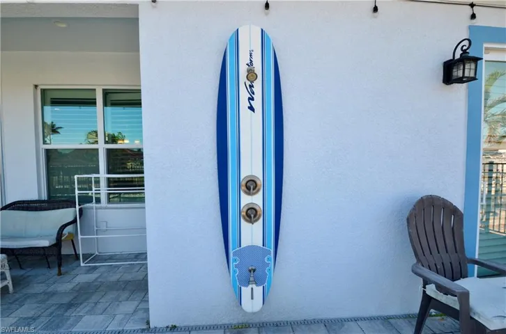 Outdoor "Surfboard" Shower with foot sprayer.