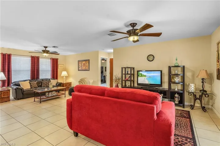 View of both areas. Tiled throughout. NO wall to wall carpet.