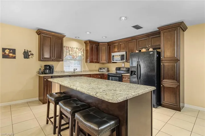 Granite counters and breakfast bar.