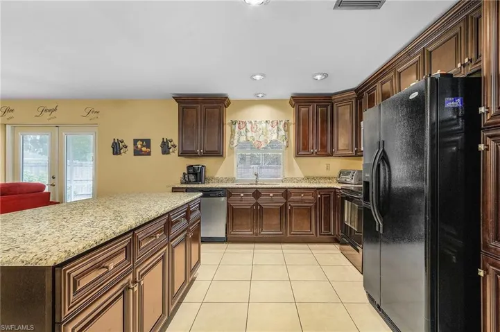 Well laid out kitchen. Plenty of storage and cabinet space. Don't you love to look out when you are working at the sink?