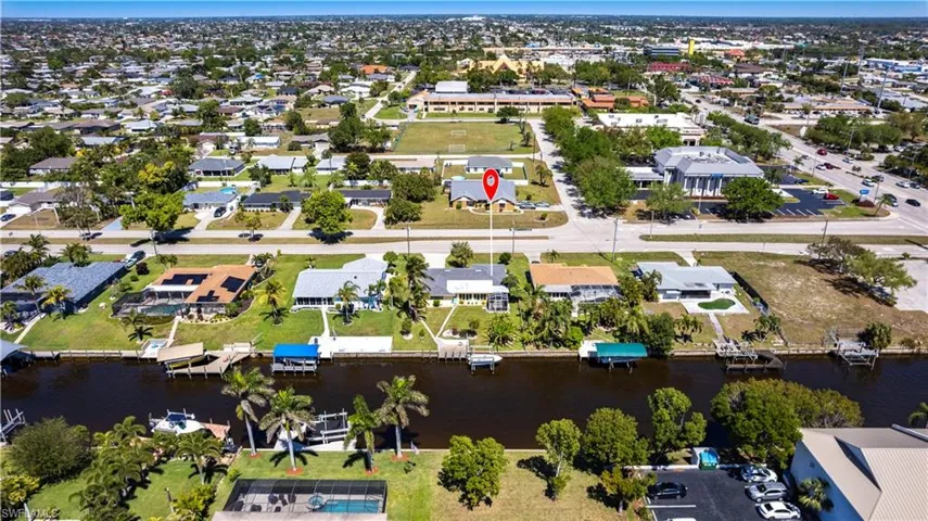 Aerial view featuring a residential view and a water view with plenty of room for a pool