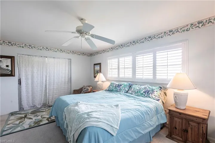 Main Bedroom featuring a ceiling fan and Walk out to Sunroom
