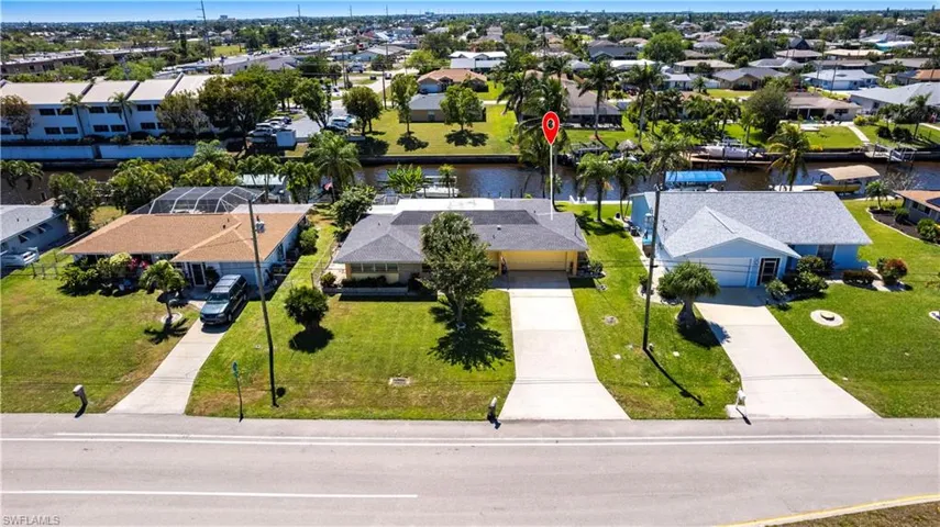 Aerial view featuring a residential view and a water view