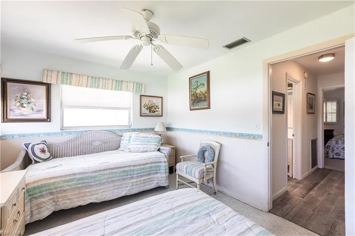 Charming Bedroom with ceiling fan and deep double closet
