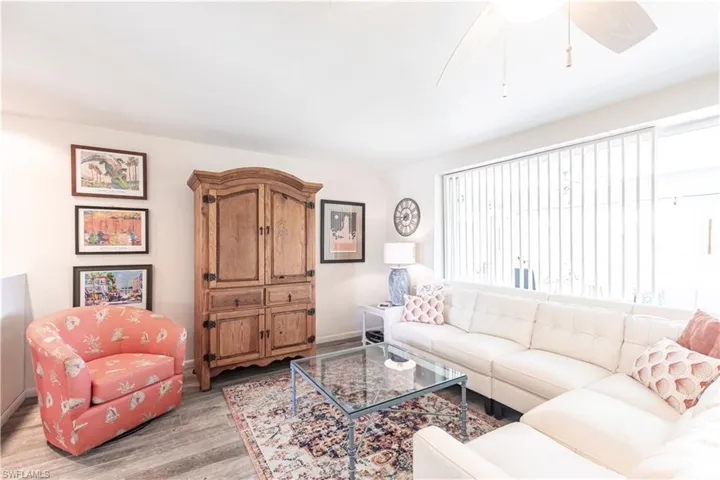 Living area featuring light wood laminated floors