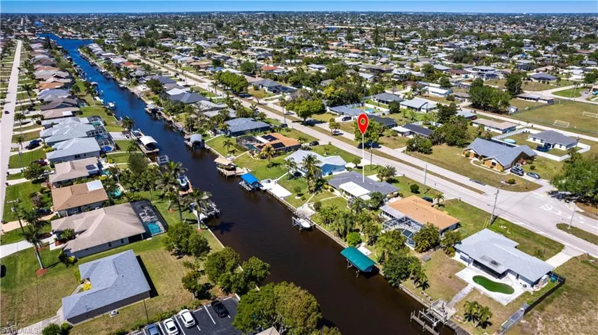 Drone / aerial view featuring a residential view and a water view