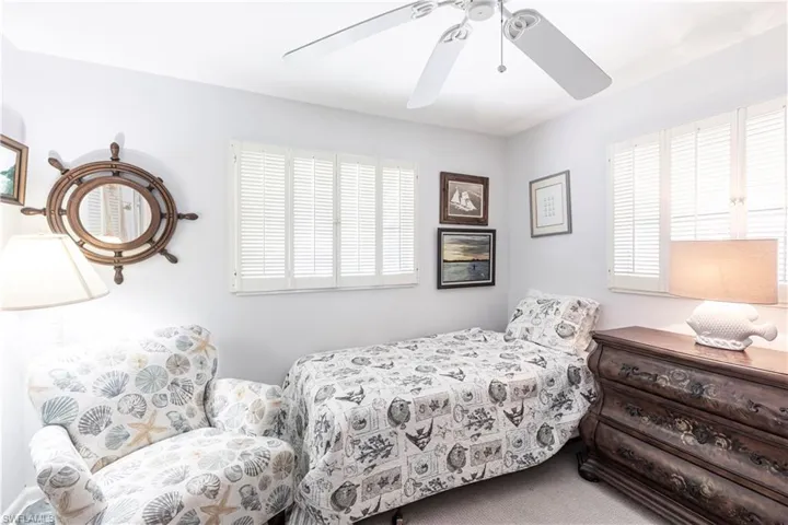 Bedroom featuring carpet and a ceiling fan