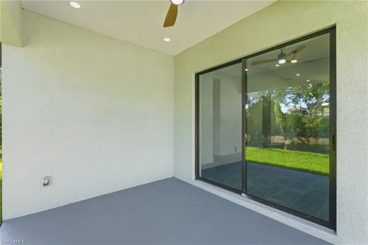 View of patio with a ceiling fan