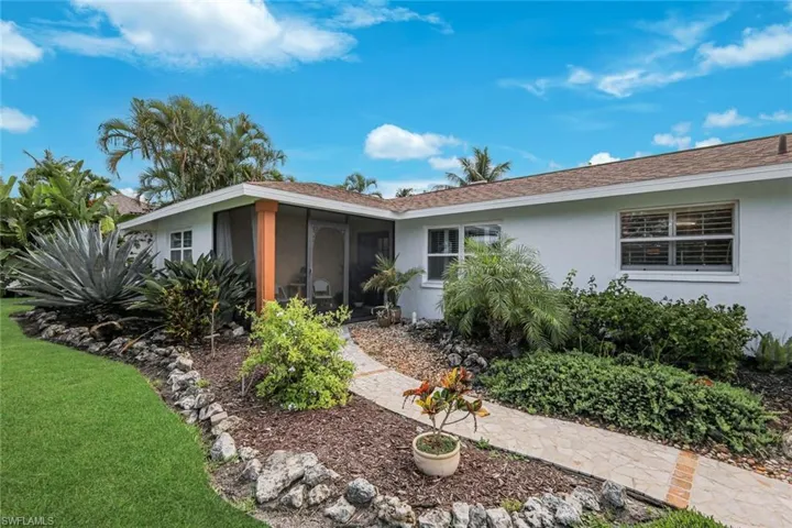 Adorned by lush landscaping and so much privacy.