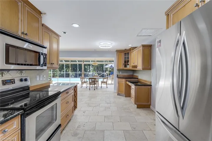 Kitchen features stainless appliances.
