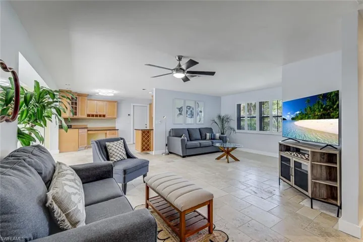 Kitchen and living room are open to one another.