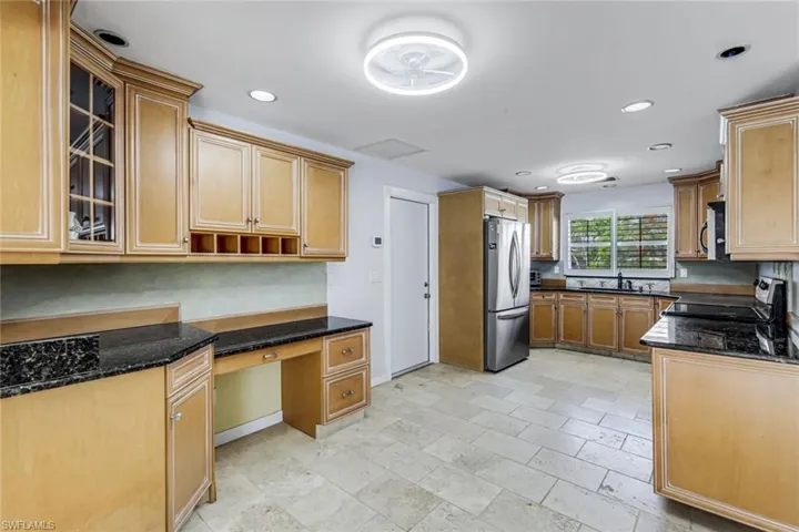 Wood cabinets offer plenty of room for storage.