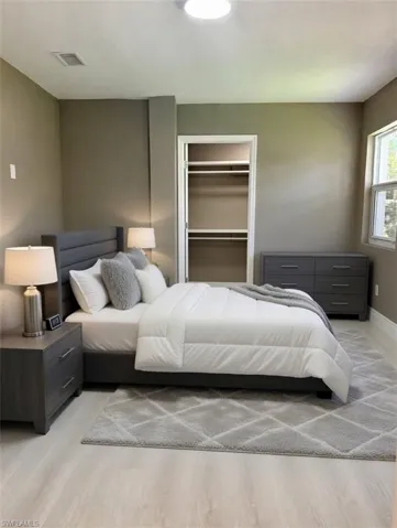 Recessed lighting illuminates wood-finish flooring