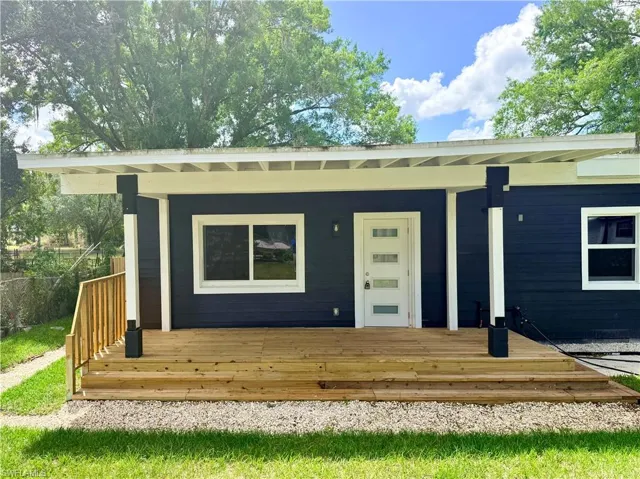 Entrance to property with a wooden deck