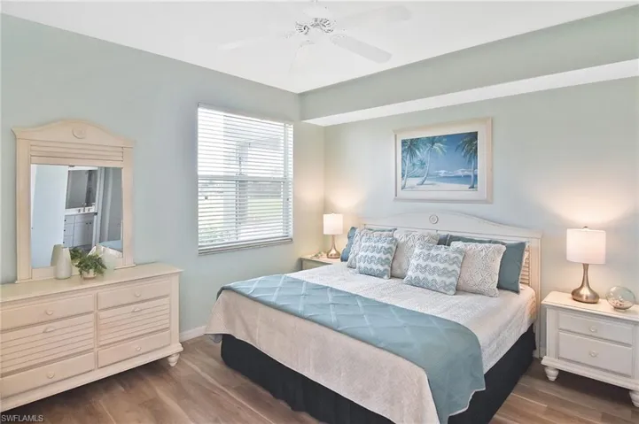 Bedroom with wood finished floors and a ceiling fan