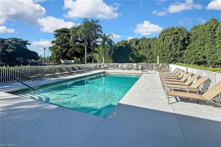 Community pool featuring a patio area