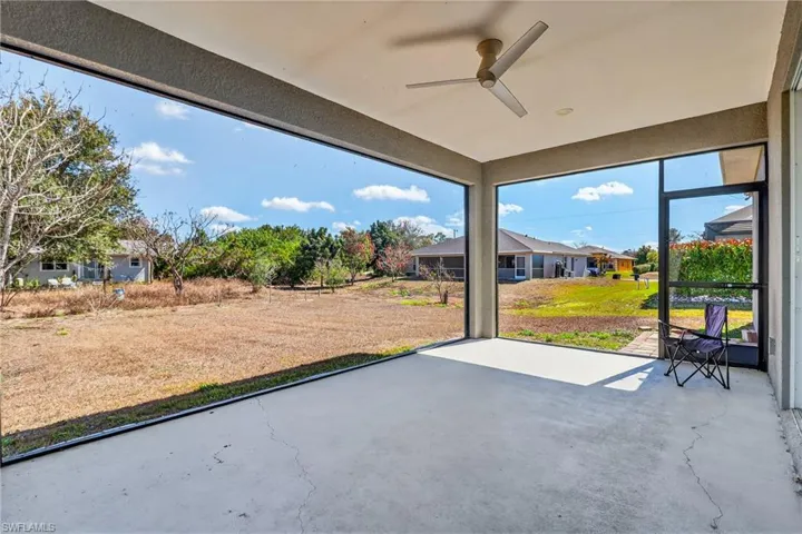 View of patio / terrace featuring ceiling fan and a sunroom