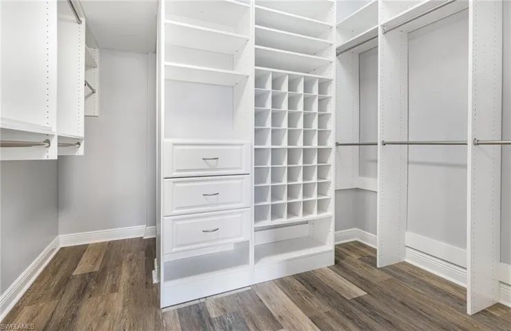 Large Master Walk In Closet with Custom Closet System