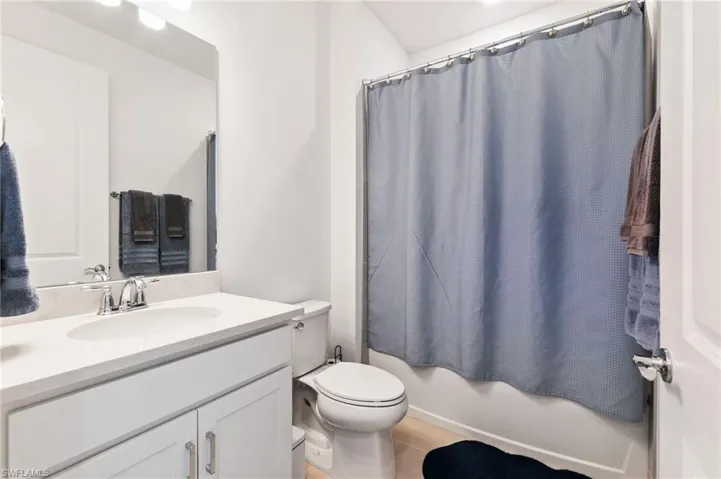 Bathroom with vanity and shower / bath combo
