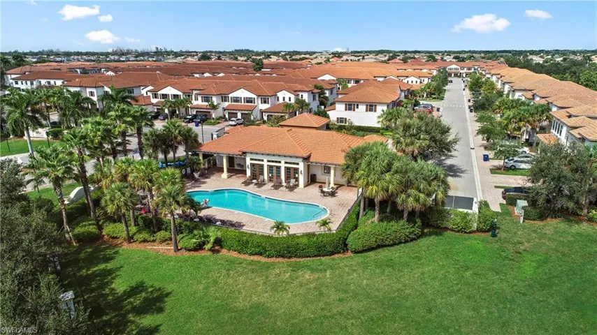 View of swimming pool with a patio and a lawn