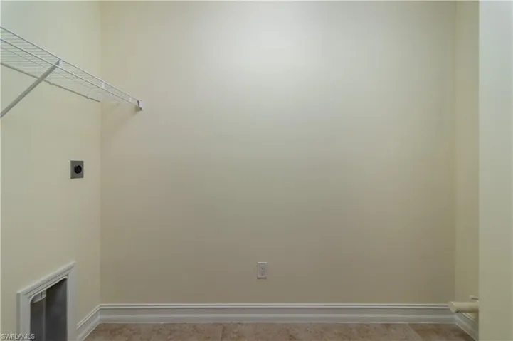 Clothes washing area with electric dryer hookup