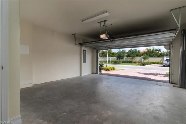 Garage featuring a garage door opener