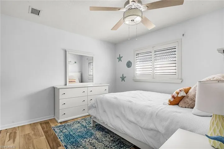 Bedroom featuring light wood finished floors and a ceiling fan