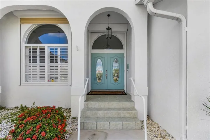 Doorway to property with stucco siding