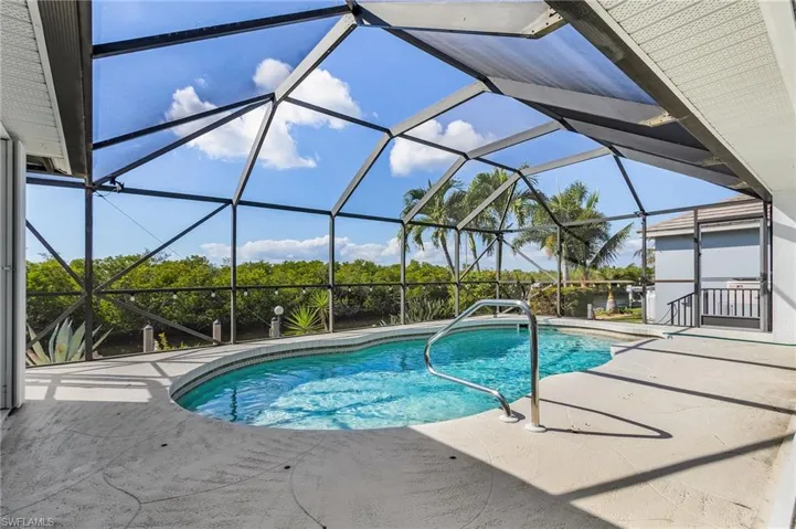 Outdoor pool featuring a lanai, a patio, and a sunroom
