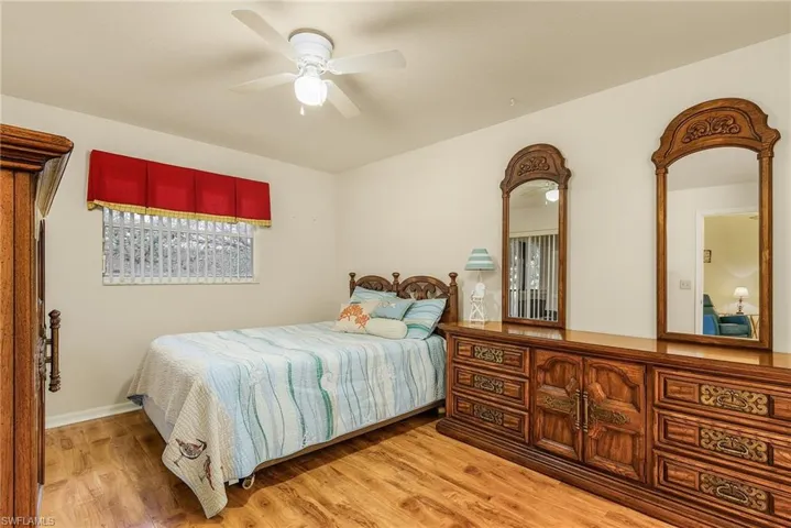 Bedroom featuring light wood-style floors and ceiling fan