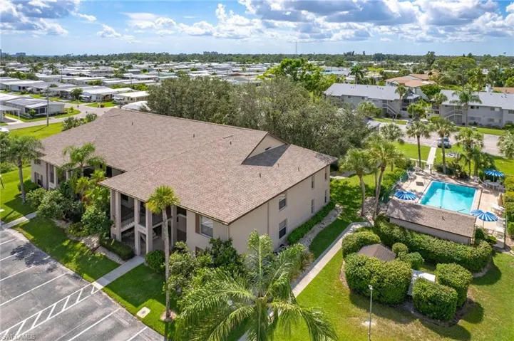 Aerial perspective of suburban area with a pool
