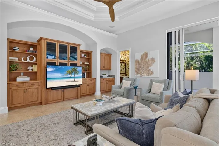 Family room with zero edge sliding glass door behind it