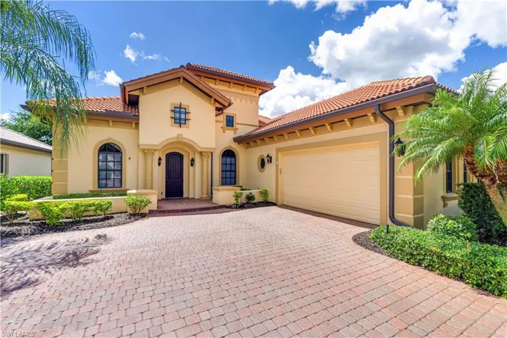 Mediterranean / spanish house with a garage
