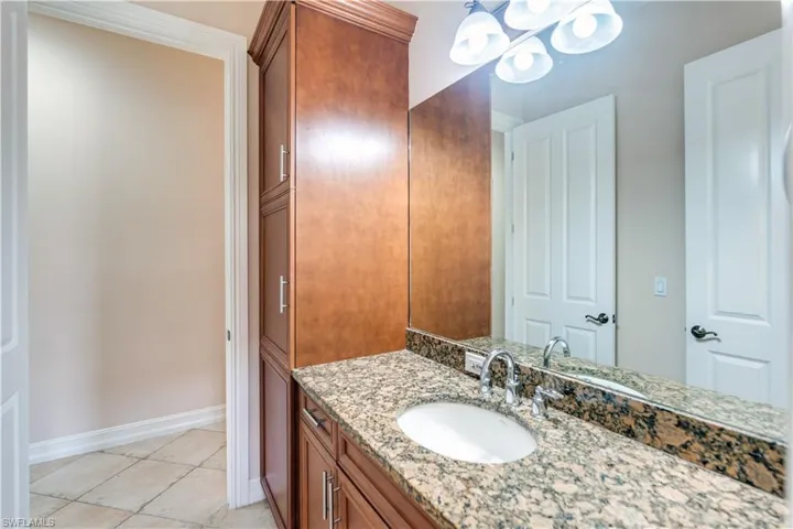 Bathroom featuring tile floors and large vanity