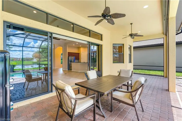 View of patio / terrace with glass enclosure and ceiling fan