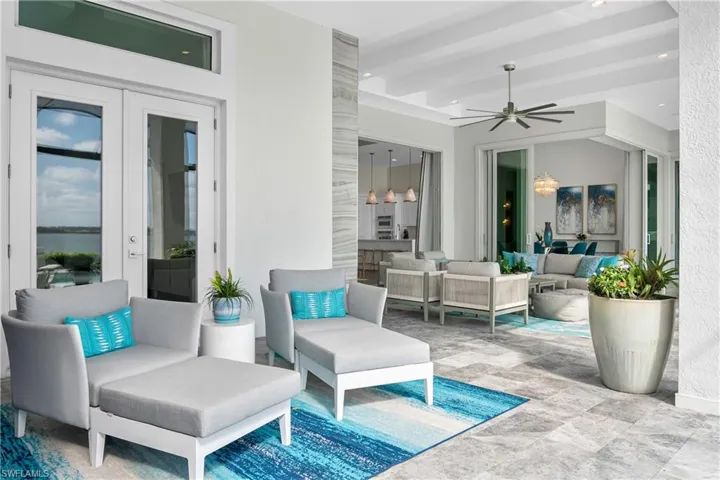 View of patio with an outdoor living space and ceiling fan