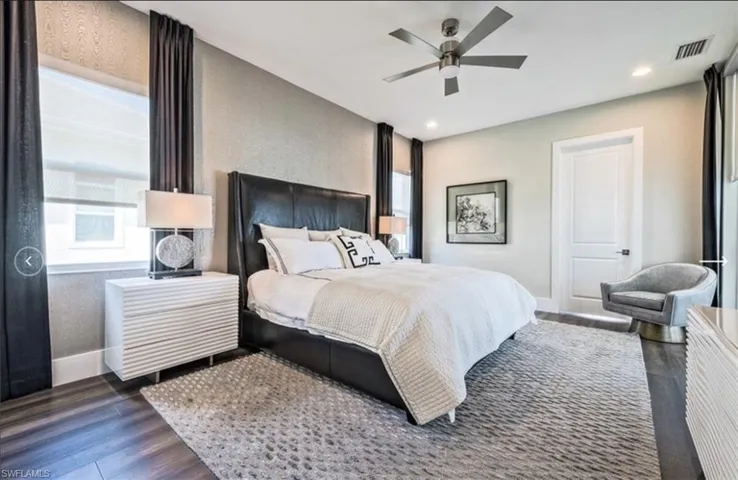 Bedroom with ceiling fan, dark wood finished floors, and recessed lighting