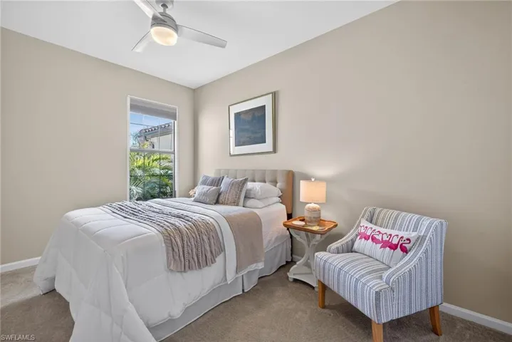 Bedroom with carpet flooring and ceiling fan