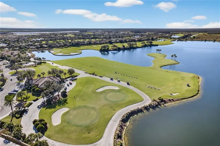 Bird's eye view of a local golf course and a large body of water