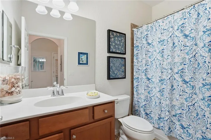 Bathroom featuring vanity and shower / tub combo