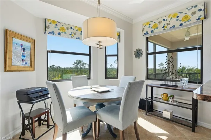 Dining room featuring ornamental molding and baseboards