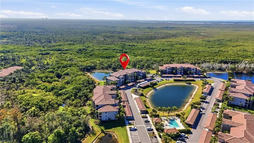 Aerial view of property's location with nearby suburban area