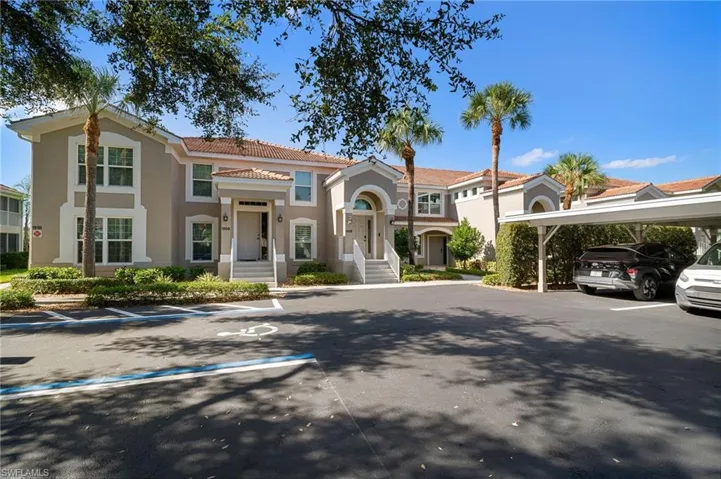 Mediterranean / spanish-style house featuring uncovered parking, a tile roof, and stucco siding