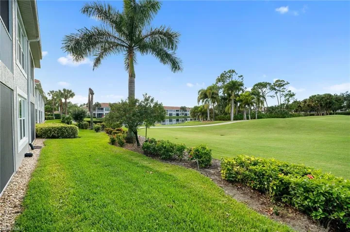 View of grassy yard featuring view of golf course
