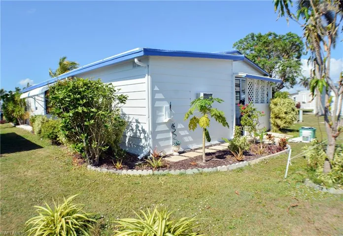 Rear/side view with beautiful landscaping
