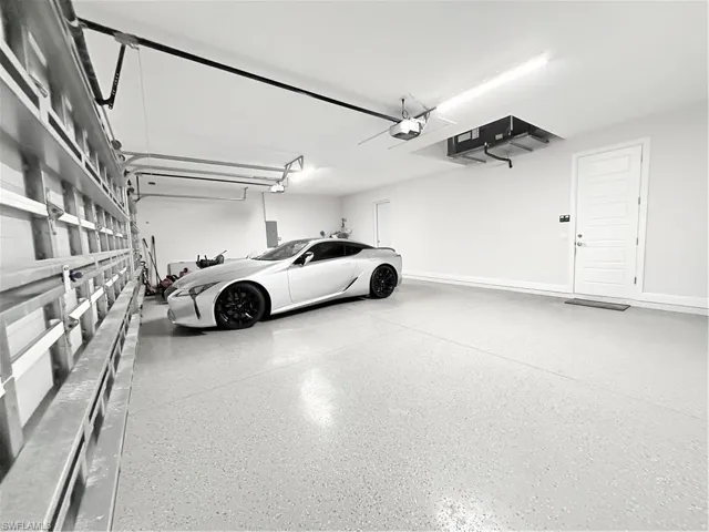 Garage featuring a garage door opener